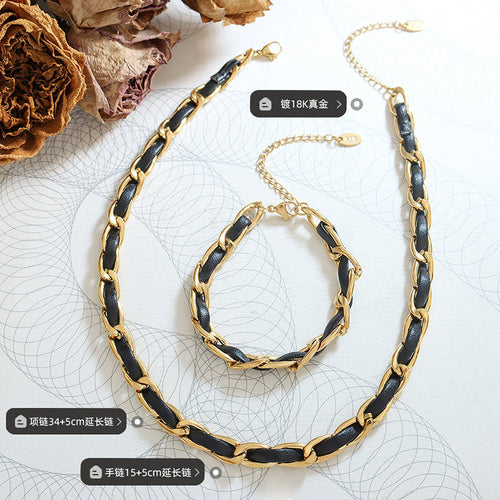 Gold black leather necklace and bracelet flat lay with length labels