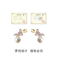 Gold Tone Spoon Top Purple Bow And White Pearl Stud Earrings view 3