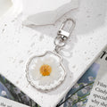 Silver Tone Shell and Floral Pressed Flower Clip Keychains view 2