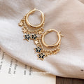 Gold Star Charm Huggie Hoop Earrings Statement Jewelry Design view 4