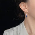 Gold Fishhook Earrings White Shell Dark Blue Stone Drops view 2