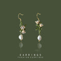 Gold Tone Green Branch White Flower And Pearl Hook Earrings view 1