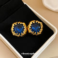 Deep Blue Faceted Stone Stud Earrings in Textured Gold Tone view 2