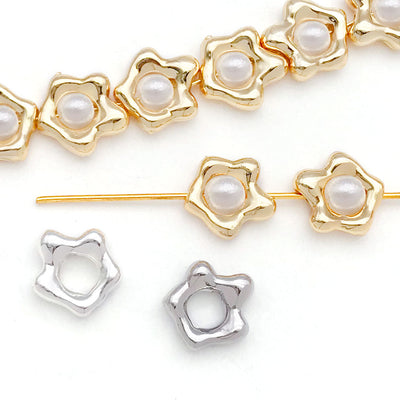 Gold-tone bead frame charms arranged on a light background