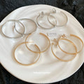 Oversized Polished Hoop Earrings with Distinctive Textured Details view 4