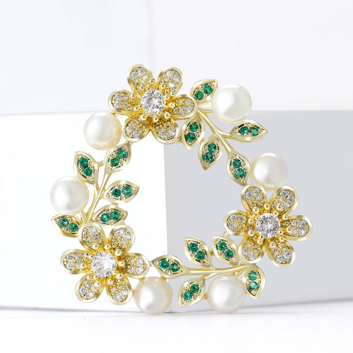 Close-up product view showing the colors and surface details of the floral wreath brooch