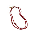 Layered Red Beaded Necklace with Knotted Strands and Gold Tone Accents view 5