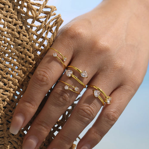 Gold dual heart and dual round open rings worn on hand