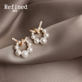 Gold Tone Clear Stone Bow And White Pearl Circle Stud Earrings view 3