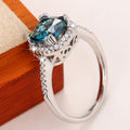 Deep Blue Cushion Solitaire Halo Ring In Polished Silver Tone view 3