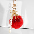 Faux Fur Pompom Charm With Pearl Beaded Strap And Bow view 3