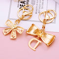 Mixed Letter D Bow and Pearl Mini Bow Keychains in Two Designs view 4