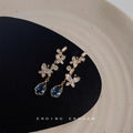 Gold Tone Clear Stone Floral Branch And Blue Teardrop Stud Earrings view 3