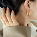 Twisted U-Shape Hoop Earrings Gold Steel Color Options view 4