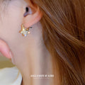Gold Tone Crystal Star Hoop Earrings with Open Centers view 4