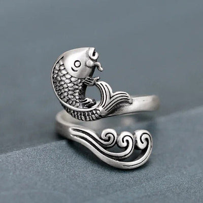 Front three-quarter antique silver koi open ring on fabric