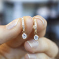 Gold Tone Pave Huggie Hoop Earrings Round Dangle Stones view 1