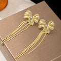 Gold Tone Sculptural Bow and Four Bar Tassel Earrings view 2