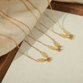 Gold Double Fish Charm Necklace With Three Bead Accents view 3
