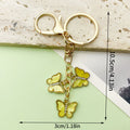 Butterfly Charm Keychains Featuring Blue Butterfly Across 35 Pictured Variations view 7