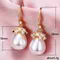 Pearl Drop Earrings With Crystal Floral Caps in Two Finishes view 5