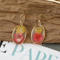 Gold Tone Clear Resin Pressed Flower and Leaf Hook Earrings view 3