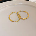 Textured Hoop Earrings in Five Gold and Silver Tone Styles view 9