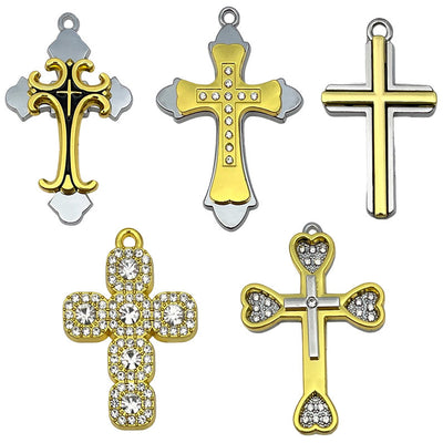 Gold-tone cross charms arranged on a light background