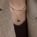Gold Tone Layered Necklace with Brown Oval Pendant view 1