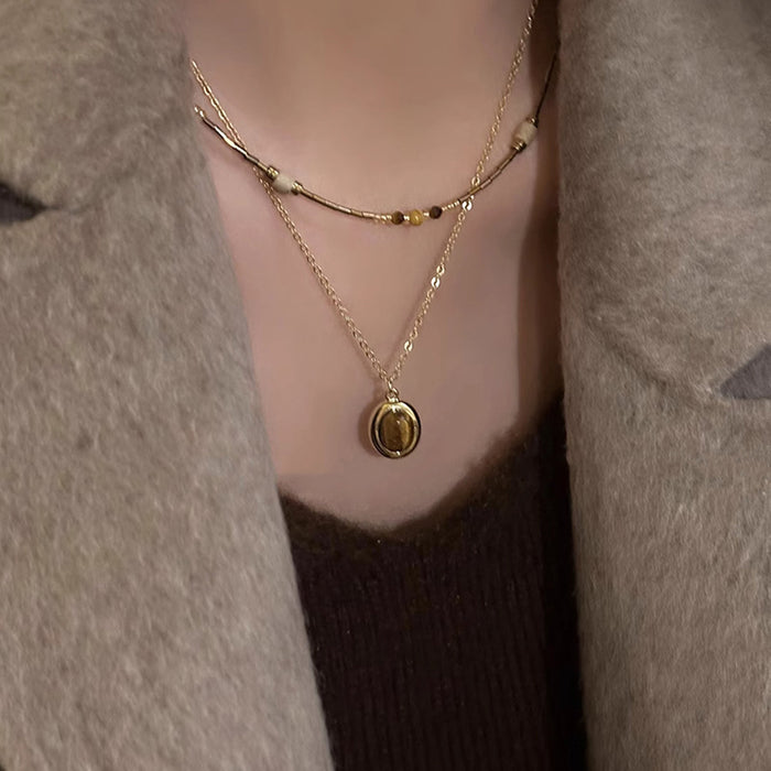 Gold Tone Layered Necklace with Brown Oval Pendant