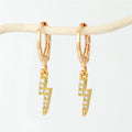Gold Tone Huggie Earrings with Six Small Symbolic Drop Charms view 1