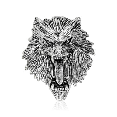 Front view of detailed roaring lion head brooch in gold and silver tone