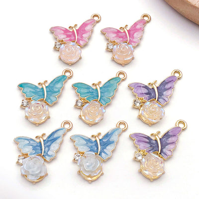 Colorful butterfly charms arranged on a light background