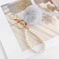 Faux Fur Pom-Pom Keychain with Faux Pearl Wristlet Strap view 9