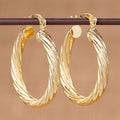 Twisted Oval Hoop Earrings in Three Gold-Tone Styles view 6