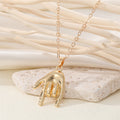 Gold Tone Sculpted Hand, Foot and Ear Pendant Necklaces view 4