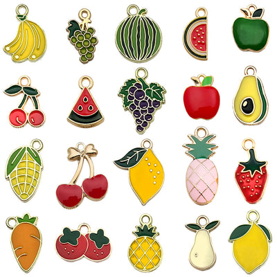 Colorful strawberry and banana charms arranged on a light background