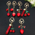 Six Red Rhinestone Cherry and Strawberry Metal Keychain Designs view 1