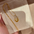 Gold Tone Textured Feather and Crystal Pendant Necklace view 6