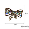 Crystal Bow Brooch in Metal with Crystal-covered Loops and a Colored Center Stone view 5
