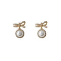 Gold Tone Clear Stone Bow And White Pearl Halo Drop Stud Earrings view 5