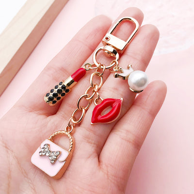 Image 1 showing fashion accessory keychains shown in the product image.