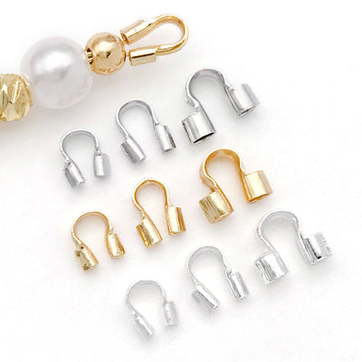 U shaped metal cord guardians in three sizes arranged as a full product overview