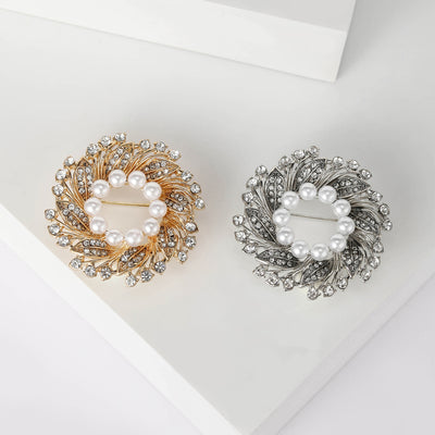 Front product view of the pearl center floral wreath brooch on a light background