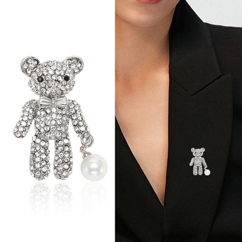 Close-up product view showing the colors and surface details of the crystal teddy bear brooch