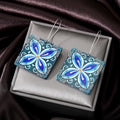 Silver Tone Blue Floral Butterfly and Evil Eye Acrylic Hook Earrings view 2