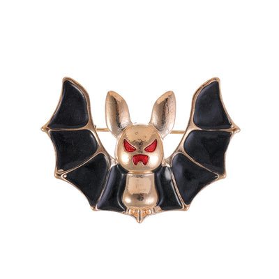Front product view of the bat brooch pin in gold and black
