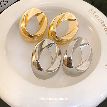 Sculptural Open Oval Stud Earrings in Gold and Silver Tones