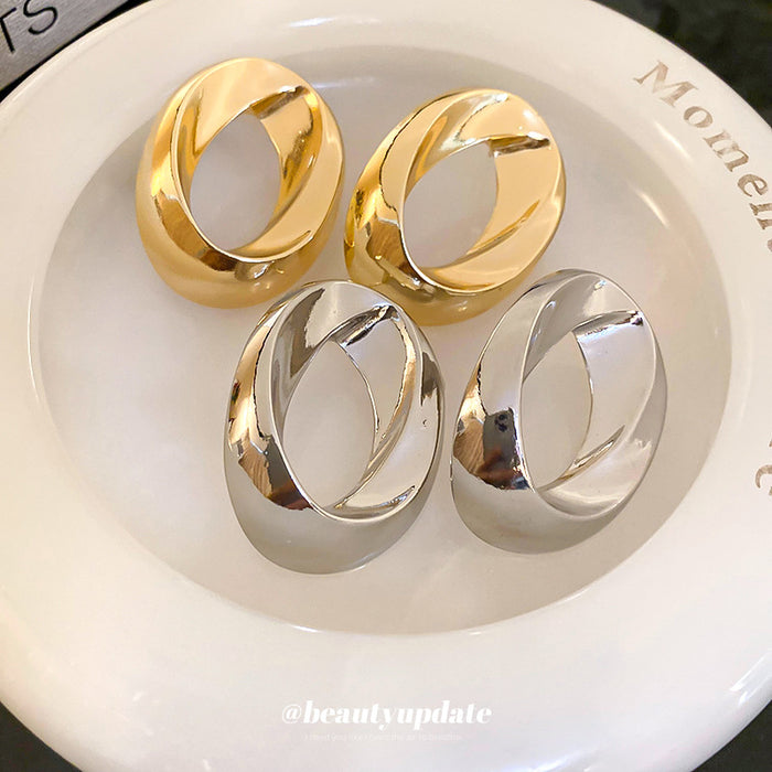 Sculptural Open Oval Stud Earrings in Gold and Silver Tones