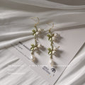 Gold Tone Green Leaf White Flower And Pearl Long Hook Earrings view 4